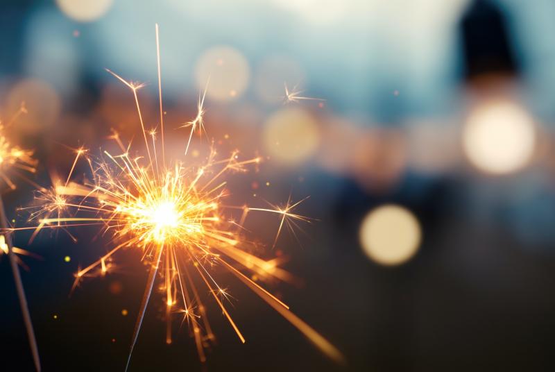 Sparklers against a city background