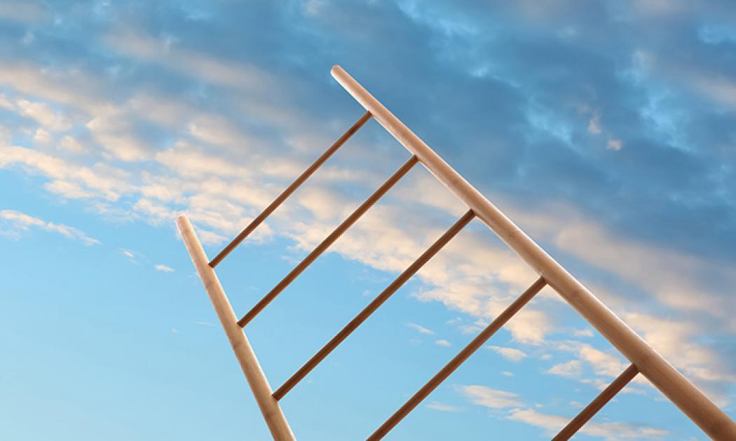 Wooden ladder against blue sky with clouds, low angle view