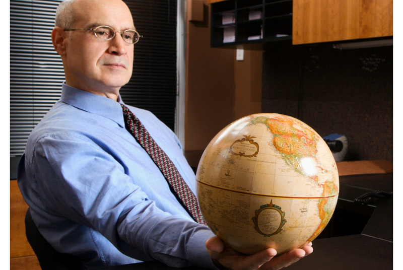 Businessman holding globe